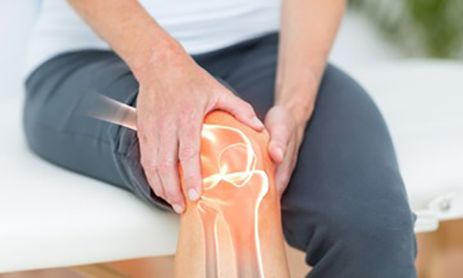image of a highlighted knee suffering with pain